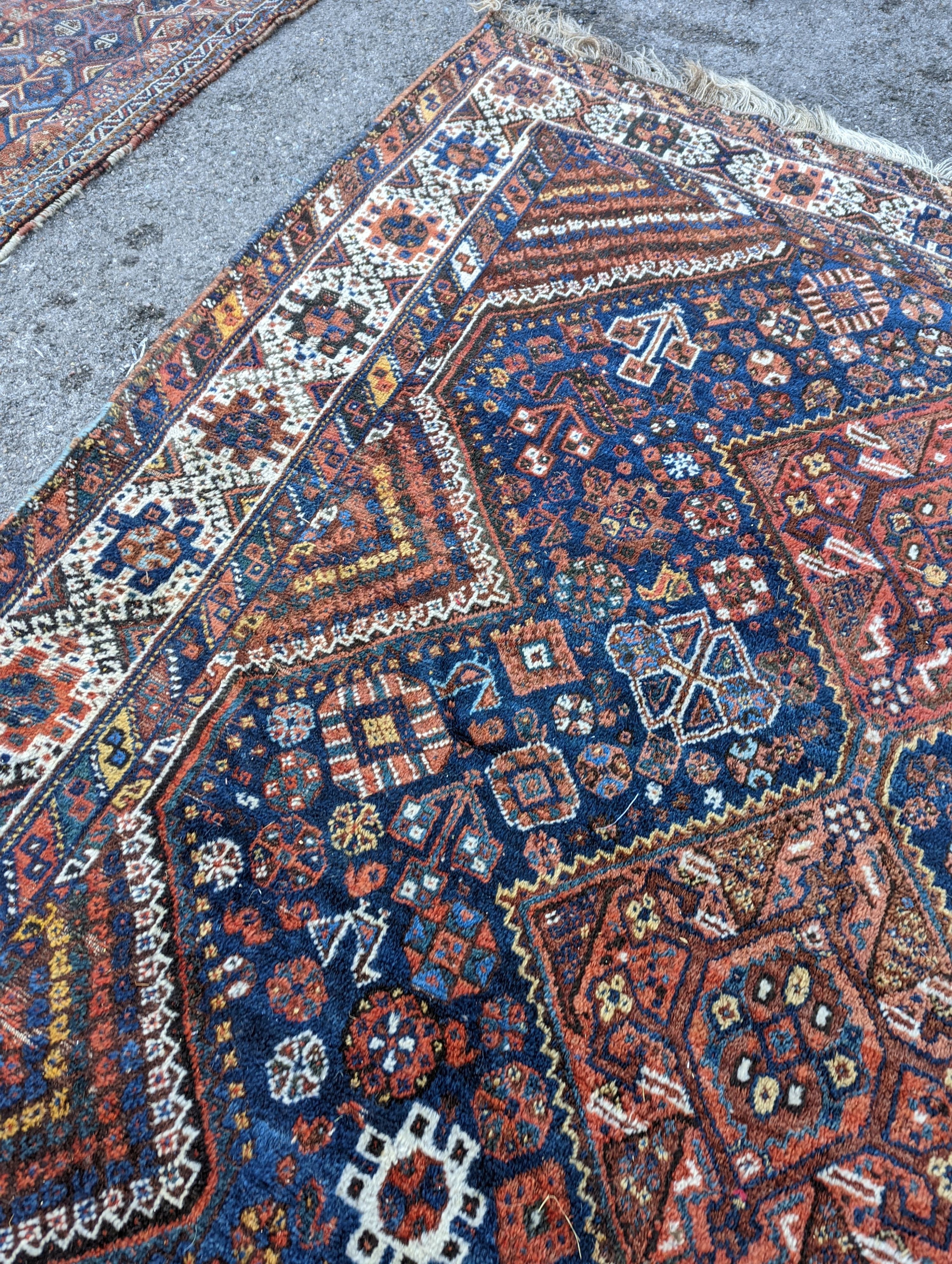 A Shirvan blue ground carpet, 315 x 222cm